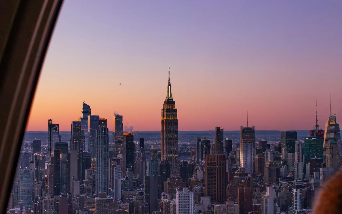 Low gold light on the Midtown Manhattan towers from a helicopter