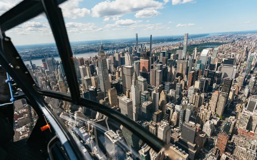 The cabin of a private helicopter with the New York skyline beyond